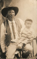 Man and child posing for picture - "This Indian is a farmer - his name is Deafy" Native Americana Postcard Postcard Postcard