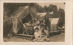 Group of Women sitting in front of tent in camp Postcard