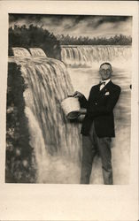 Studio portrait of man catching water from Niagara Falls Men Postcard Postcard Postcard