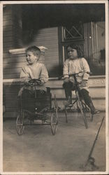 Two children tricycle and toy cart Postcard Postcard Postcard