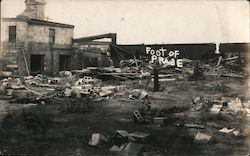 Building destruction by railroad with train Postcard