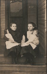 Girls with their dolls sitting on front porch Postcard Postcard Postcard