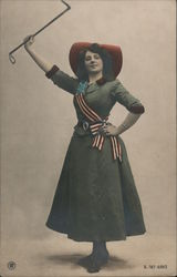 Colorized photo of woman wearing patriotic banner and bow with riding crop Postcard