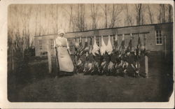 Woman with Gun Standing Next to Dead Birds Postcard