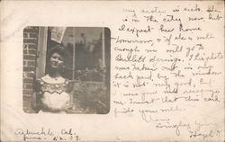 Portrait of woman outside window Postcard