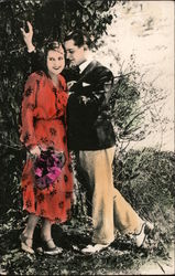 Art Deco Man and woman standing together under a tree Postcard