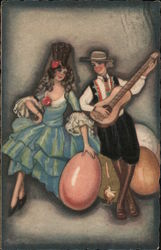 Man and woman wearing hats, sitting on/near large eggs; Man plays guitar Postcard