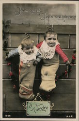 Two Babies Hanging on the Wall in Stockings Postcard