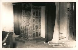 San Buenaventura Mission confessional showing Indian carvings Postcard