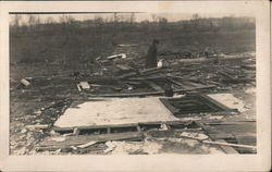 A Woman Walking Through a Destroyed Property Postcard