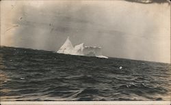 A Large Iceberg Floating in the Ocean Postcard