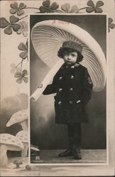 A Happy New Year - Child holds umbrella that resembles mushroom Children Postcard Postcard Postcard