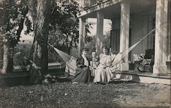 Man with With Two Girls in a Hammock Postcard