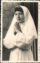 Young woman in a nun's habit Postcard