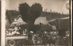 Parade float and a horse-drawn vehicle Postcard