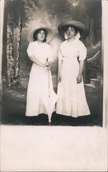 Two Women in White Dresses and Large Hats Postcard