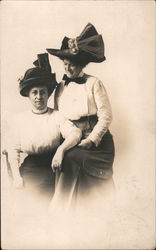 Two Women, One Sitting, One Standing, Dressed Up Wearing Hats Postcard