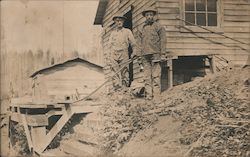 Two men standing in front of a building Postcard Postcard Postcard