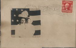 Woman and girl in white dresses, in front of a flag Postcard