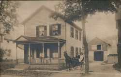 Couple in Buggy Outside of House Postcard