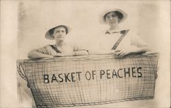 Basket of Peaches-Two women standing in a large basket Postcard