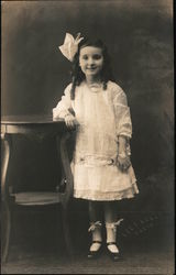 Little girl posing in a light-colored dress and hair bow San Francisco, CA Children Postcard Postcard Postcard