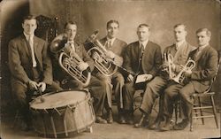 Brass Band with one drummer, two tubas, two trumpets, and conductor Postcard