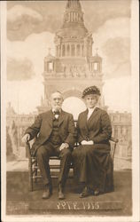 Studio: Older Man and Wife Pose for Souvenir Photo - P.P.I.E. 1915 San Francisco, CA 1915 Panama-Pacific Exposition Postcard Pos Postcard