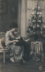 A Woman and her Child Read a Book at Christmastime Children Postcard Postcard Postcard