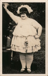 Fat Woman In Short Dress Posing Next to a Car Postcard