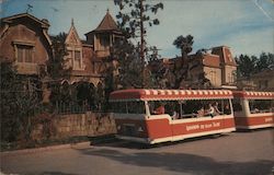 The chill of the Munsters is felt on Mockingbird Lane as the tram passes their spooky, cobwebbed home Universal City, CA Postcar Postcard