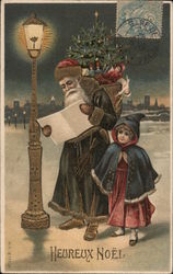 Heureux Noel - Santa Claus Checking his List Near a Lamp Post While A Child Waits Postcard