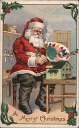 Santa Paints a Small Toy House in his Workshop Santa Claus Postcard Postcard Postcard