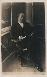 William Jennings Bryan in a Chair Reading a Book Postcard