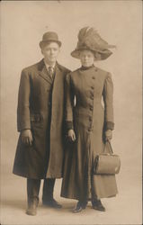 A Man and a Woman in Coats and Hats Postcard