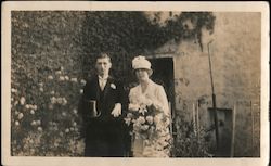 A Bride and Groom Standing Outside a Church Postcard