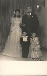 A Bride and Groom with a Ring Bearer and a Flower Girl Postcard