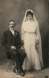 A Groom Sitting Next to his Standing Bride Marriage & Wedding Postcard Postcard Postcard