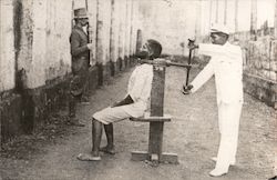 Garotte Prison Torture Chair with occupant and guard Prisons Postcard Postcard Postcard