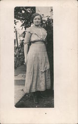 A Woman Posing in a Garden Postcard