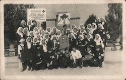 Group of nurses in uniform - Red Cross workers, Cyrillic lettering on sign Postcard