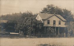 A house surrounded by a fence in a street Calistoga, CA Postcard Postcard Postcard