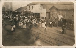 Main street view, Star Tobacco, Railroad track, gathering of people Postcard