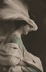 Woman in green dress with white feathered hat Postcard