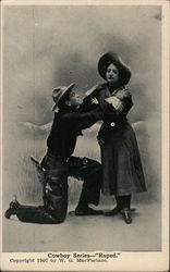 Cowboy Series Roped Cowboy on knees in front of woman Postcard