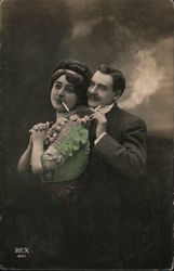 Portrait of a couple smoking cigarettes Couples Postcard Postcard Postcard