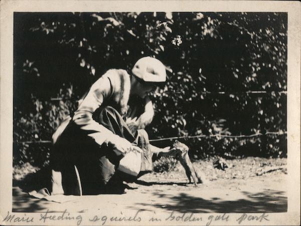 Woman feeding squirrels in Golden Gate Park San Francisco, CA Original