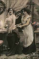 Man watching a woman getting out of dress with help of maid, Corset Postcard