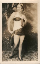 Woman with minimal clothing standing on a rug posing Risque & Nude Postcard Postcard Postcard