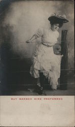 Barbed Wire. Woman caught in barbed wire fence. Postcard